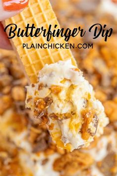 a scoop of butterfingered dip is being held up with a waffle cone