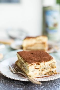 a piece of cake sitting on top of a plate next to a knife and fork