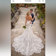 a bride and groom walking down a stone path