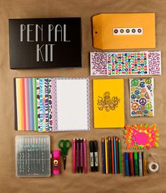 the contents of a pen pal kit laid out on a table