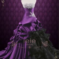 a purple and black wedding dress on display