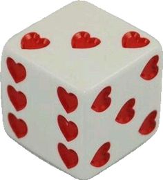 a white dice with red hearts on it