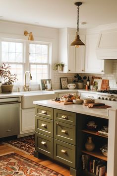 a kitchen with green cabinets and white counter tops, an area rug on the floor