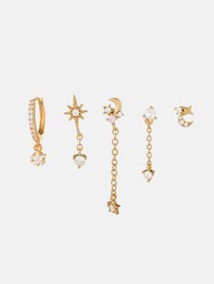 five pairs of earrings with chains and stars on them, all in different shapes and sizes