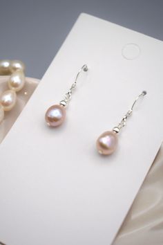 These earrings feature a single dusty pink/purple freshwater pearl with a sterling silver bead on a pair of sterling silver hooks. These earrings make for a great everyday casual wear or even a simple yet effective pop of elegance to an occasion outfit. You cant go wrong with these earrings, so versatile and can be worn with anything! Occasion Outfit, Silver Bead, Pink Pearl, Pearl Drop Earrings, Pearl Drop, Sterling Silver Bead, Dusty Pink, Freshwater Pearls, Pink Purple