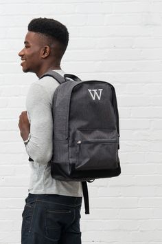 Our classic, heathered black, water resistant backpack doesn’t have to be used only as a book bag. It’s a medium size that fits comfortably on your back and the large pocket has plenty of space for books, shoes, gym clothes, a laptop, or travel clothes. For a special touch, the black backpack can be personalized with a custom embroidered name or set of monogrammed initials making it a great gift idea for any of the men or women on your list available at a cheap price. Black Laptop Bag, Water Resistant Backpack, Canvas Travel Bag, Backpack Gift, Travel Clothes, Back To School Backpacks, Weekend Travel Bags, Personalized Backpack, Custom Laptop