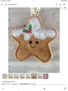 a christmas ornament with a star shaped cookie hanging from it's side