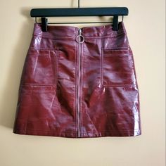 Wild Fable Faux Leather Burgundy Front Zipper A-Line Mini Skirt Size Small Color: Burgundy Faux Vegan Leather Front Zipper Closure With Two Front Functioning Pockets, Fully Lined New Without Tags, No Flaws, Holes, Snags, Or Discolorations. The Waistband Does Not Stretch. There Is No Elasticity In This Skirt. The Faux Leather Is Shinny, Not Matte. Length: 16" Inches Waistband Circumference: 28.5" Inches Hips: 35.5" Inches See Pictures For Details. Measurements Are Measured To My Best Ability. As Trendy Mini Skirt With Zipper Closure For Fall, Trendy Fall Mini Skirt With Zipper Closure, Fall Mini Skirt With Zip Fly, Valentine Looks Outfit, Fall Faux Leather Mini Skirt With Zipper, Faux Leather Mini Skirt With Zipper For Fall, Valentine Looks, Cheerleader Skirt, Light Teal Color