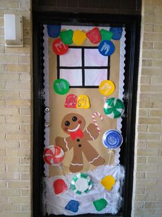 a door decorated with gingerbreads and candy