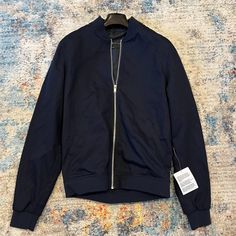 Navy Bomber Jacket From Asos In New With Tags Condition. Size Is Xs But Fits Like A Slim 36. 100% Cotton. Measurements Chest: 36" Shoulder: 16" Sleeve: 27" Body Length: 25" Let Me Know If You Have Any Questions Or Want Further Details. Navy Casual Track Jacket With Pockets, Urban Spring Track Jacket For Workwear, Navy Outerwear With Ribbed Cuffs For Fall, Trendy Blue Outerwear With Ribbed Cuffs, Fitted Blue Outerwear With Ribbed Cuffs, Blue Outerwear With Ribbed Cuffs For Fall, Fitted Navy Outerwear For Streetwear, Navy Cotton Outerwear For Spring, Navy Track Jacket For Spring Streetwear