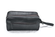 Trustpilot Keep your all grooming products organized and accessible with this stylish black leather toiletry bag. Whether you’re going globetrotting or heading to the travel and gym, this essential small leather piece of kit will help you organize your things easily so you can take them with you wherever you go.Made from real full-grain goat leather its simple yet sturdy design will survive spills and withstand being thrown into your luggage time after time to last you for years. Salient Feature Black Leather Pouch For On-the-go, Black Cosmetic Bag With Luggage Sleeve For Everyday, Black Cosmetic Bag With Luggage Sleeve, Black Leather Travel Cosmetic Bag, Black Pouch Cosmetic Bag For Business, Black Business Cosmetic Bag Pouch, Black Business Cosmetic Pouch, Black Leather Cosmetic Bag For Daily Use, Black Leather Pouch Cosmetic Bag