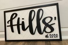 a black and white sign that says fil & b on the side of a wall