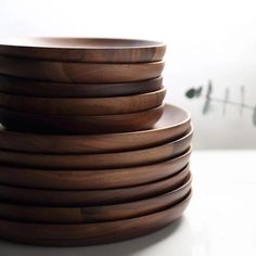 a stack of wooden plates stacked on top of each other