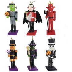 six halloween nutcrackers are shown in different colors and sizes, including one with a top hat