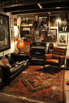 a living room filled with furniture and lots of pictures on the wall next to a guitar