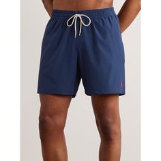 Polo Ralph Lauren's 'Traveler' swim shorts are cut in a comfortable mid-length shape, so you can be active in them on the beach. They're made from moisture-wicking stretch-shell and lined in lightweight mesh. Sporty Navy Swimwear With Built-in Shorts, Navy Swimwear With Built-in Shorts, Beach Swim Trunks With Pockets, Blue Short Leg Swim Trunks For Beach, Navy Nylon Shorts, Blue Bermuda Swim Trunks For Beachwear, Blue Sport Swimwear With Short Legs, Navy Athleisure Shorts For Summer, Blue Sports Swimwear With Short Legs