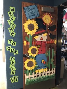 a door decorated with sunflowers and a scarecrow