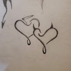 a drawing of two hearts with the word love written in it's lower half