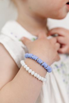 A bright white bead that sparkles like the the snow in sunshine. It's the ultimate neutral bracelet! The perfect accessory for every little girl! Made with the highest quality materials, this bracelet will look beautiful for years to come. Durable enough for play, precious enough to keep forever. Materials: 14k gold filled or sterling silver components. Nickel free. To learn more about our materials and what makes gold filled unique read here. Features: Each bracelet has a ½” extender chain to a Baby Nazaria Bracelet, Light Blue Stretch Bracelet With Round Beads, White Beaded 14k Gold-filled Bracelets, White 14k Gold-filled Beaded Bracelets, Infant Bracelets Baby, Neutral Bracelet, Neutral Bracelets, Baby Bracelet, White Beads