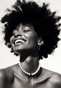 a black and white photo of a woman laughing