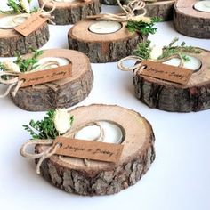 wooden slices with tags tied to them sitting on a table