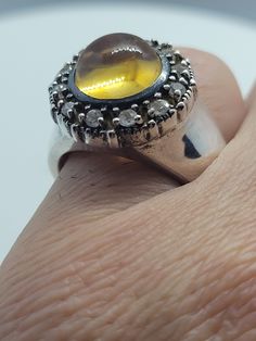 This ring is set in 925 sterling silver and features a 10 mm yellow citrine and white sapphire gemstones. We have in size 8, this can be sized to your specification, please message us to discuss sizing your ring or engraving options. All of our jewelry is hand polished and shipped to you in a stylish gift box. We are happy to gift wrap for you. It is important to us that each customer be thrilled with their purchase. We are grateful for thousands of positive reviews. Elegant Yellow Ring Stamped 925, Silver Yellow Sapphire Rings For Anniversary, Yellow Sterling Silver Rings With Gemstone Accents, Amber Topaz Ring In Sterling Silver, Silver Ring With Yellow Sapphire For Gift, Polished Yellow Topaz Ring, Polished Yellow Topaz Round Ring, Yellow Topaz Ring With Polished Finish, Yellow Sterling Silver Ring With Gemstone