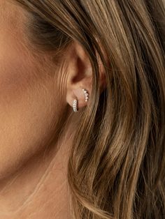 Add a touch of chic sparkle with our Kelly Climber Stud Earrings. These graduated diamond studs are designed in a graceful curved shape, making them perfect for second or third piercings. Crafted to enhance your everyday style, these earrings offer a playful yet elegant look that’s both versatile and irresistibly cute. Tennis Jewelry, Diamond Huggie Earrings, Everyday Elegance, Huggie Earrings, Religious Jewelry, Gold Filled Jewelry, Huggies Earrings, Diamond Studs, Everyday Style