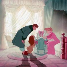 an animated image of a man and two women with a child in front of a bed