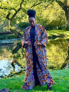 African print duster in a multi-coloured floral print. It has deep side splits and comes with a wide belt in the same fabric and can be worn with or without the belt. Wrap up securely with the same fabric belt or your favourite belt or wear as a throw on or cover up. May be dressed up or down to suit the occasion. Handmade in Ghana. 100% cotton. HAVE YOU CHECKED YOUR MEASUREMENTS AGANST THE SIZE CHART FOR THIS SHOP? Although we do our best to make sure that the colours displayed on our Website a Textures Fabric, Side Splits, Fabric Belt, Wide Belt, African Print, Ghana, Cover Up, Floral Print, Multi Color