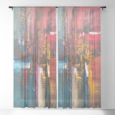 a window curtain with an abstract painting on it