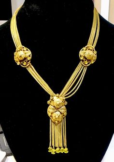 "Rare Antique Edwardian Pinchbeck Czech Facet Cut Yellow Glass Necklace. Always amazing to find a piece of jewelry from the Edwardian era. The necklace has six strands with three floral medallions. The Medallions have prong set yellow crystals. The center largest medallion has a tassels dangles, five with square yellow crystal beads. The ends are finished off with a floral hook and ring as a clasp. The necklace measures 8\" on each side up to the lavaliere style pendant. The largely floral medal Collectible Yellow Gold Filigree Necklaces, Yellow Gold Filigree Necklaces, Collectible Yellow Gold Necklaces With Intricate Design, Collectible Yellow Gold Necklace With Intricate Design, Collectible Intricate Yellow Gold Necklace, Gold Filigree Necklace For Collectors, Vintage Yellow Gold Necklace For Ceremonial Use, Vintage Yellow Gold Necklace For Ceremonial Occasions, Collectible Gold Necklace With Intricate Design