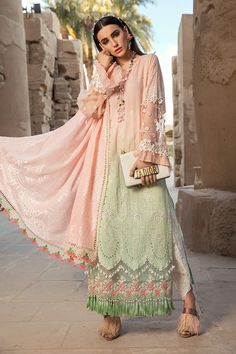 The new party and festive wear collection is all set to grab your attention with formal eid dresses. You can buy lavish fancy wear online to adorn your special event look in an elegant way. Shirt: This lavish festive attire is showing its grace with elegant pink and green color embroidered panels for shirt. Chiffon shirt is embellished with schiffli embroidered front and printed back panel. Neck is designed with lawn embroidered neckline. Schiffli embroidered sleeves are designed with beautiful Maria B Lawn, Pakistani Street Style, Pakistani Fashion Casual, Chiffon Collection, Eid Dresses, Maria B, Lawn Suits, Pakistani Dress Design, Embroidered Neckline