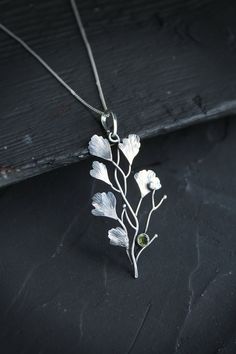 ITEM DESCRIPTION: The size H 5 cm x W 3 cm (2 x 1 inch). Weight - 3 g. Maidenhair fern is gentle and very beautiful plant. So it inspired me to create this unusual plant necklace. It looks natural and elegant at the same time. I made it of sterling silver and peridot. Tiny leaves repeat the natural shape and texture. This jewelry will not go unnoticed and will bring you many compliments. Ooak jewelry made by eco-friendly materials. This handmade necklace will come to you in a gift box - ready fo Silver Leaf-shaped Nature-inspired Necklace, Nature-inspired Leaf Shaped Sterling Silver Necklace, Nature-inspired Sterling Silver Leaf Necklace, Nature-inspired Sterling Silver Pendant Necklace, Delicate Green Sterling Silver Necklace, Delicate Green Sterling Silver Necklaces, Nature-inspired Leaf Shape Sterling Silver Jewelry, Silver Leaf-shaped Nature-inspired Jewelry, Green Leaf-shaped Botanical Jewelry