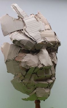 a head made out of books sitting on top of a table