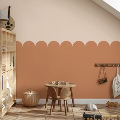 a child's playroom with an orange wall and wooden toys on the floor