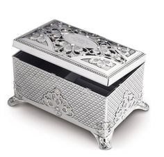 an ornate silver jewelry box on a white background