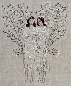 two women are standing next to each other in front of some white flowers and branches