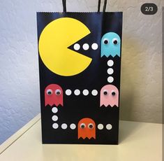 a paper bag with pacman faces on it