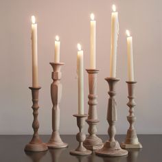 a group of candles sitting on top of a table