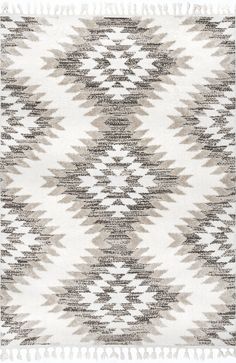 a white and grey rug with fringes on it's edges, in the shape of an abstract pattern