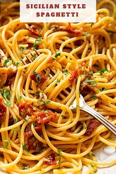 a white plate topped with spaghetti and sauce