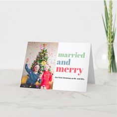 a christmas card with an image of two people in front of a tree and text that reads married and merry celebrating our first christmas together