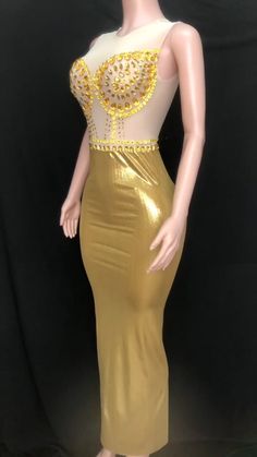 Introducing our stunning handmade Golden Graduation Gown, a masterpiece of elegance and glamour. Crafted with meticulous attention to detail, this gown is designed to make you shine on your special day. Made from a luxurious blend of spandex and polyester, this gown offers a perfect balance of comfort and style. The fabric drapes beautifully, enhancing your silhouette and allowing you to move with grace. Breathable and sustainable, this gown ensures you stay comfortable throughout your graduation ceremony. The fabric allows for airflow, keeping you cool and confident as you receive your well-deserved accolades. The empire waistline adds a touch of regal charm, creating a flattering and elongating effect. It accentuates your figure and adds an element of sophistication to your overall look. Party Gown With Fitted Bodice And Long Train, Gold Sleeveless Ball Gown For Party, Champagne Fitted Mermaid Wedding Dress, Champagne Mermaid Wedding Dress Fitted, Gold Dress With Sheer Bodice For Prom, Gold Sheer Bodice Dress For Prom, Gold Fitted Bodice Floor-length Dress, Elegant Sleeveless Gold Ball Gown, Gold Sleeveless Evening Dress For Weddings