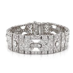 A beautiful Art Deco and retro vintage inspired diamond platinum bracelet.  Covered in stunning round cut white natural diamonds 11.29 ct in total. Diamonds get that extra sparkle against the silver brilliance of the platinum 950 metal. Diamonds are all natural in G-H Color Clarity VS. Length: 17.3 cm Width. 1.5 cm Weight: 48.5 g  #maxjewelryinc #jewelry #jewelries #artdeco #retro  #bracelet #accessories #fashion #bracelets #luxury #diamonds #diamond #bling #platinum #vintage Silver Diamond Bracelet With Pavé Setting, Platinum Diamond Bracelet With Pave Setting In White Gold, Art Deco Platinum Diamond Watch For Wedding, Art Deco Diamond Watch With Round Shape, Dazzling White Gold Diamond Bracelet In Platinum, Dazzling Platinum Diamond Bracelet In White Gold, White Gold Platinum Diamond Bracelet For Wedding, Dazzling Hand-set Platinum Diamond Bracelet, Dazzling Platinum Diamond Bracelet Hand Set