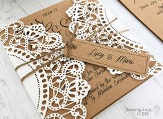 a brown and white wedding card with a tag on it