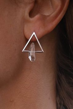 "Simplistic, gorgeous and fierce. These earrings are a perfect blend of modern style and classic elegance! The unique design features a sterling silver triangle shape, with a beautiful clear quartz crystals that add a touch sparkle to the design. Quartz crystal is known for it's ability to amplify energy and intentions and the triangle shape represents change and transformation. ▲ Sterling silver triangle post back earrings ▲ Quartz crystals  ▲ Drop length: approximately 7/8\" ▲ Handmade in Arizona Check out all of our dangle & drop earrings! https://etsy.me/3Ipx0L6 ✦ O R D E R - P R O C E S S I N G - T I M E S ✦ Orders ship 1-3 business days from the date placed. If you need it to ship sooner, please select the expedited shipping option during checkout & your order will ship the following Cosmic Jewelry, Wire Jewelry Tutorial, Birthstone Earrings, The Triangle, Triangle Earrings, Birthstone Earring, Quartz Crystals, Quartz Earrings, Clear Quartz Crystal