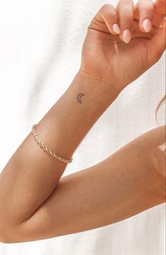 a woman with a small tattoo on her arm