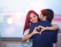 a man holding a woman in his arms