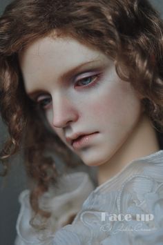 a close up of a woman with blue eyes