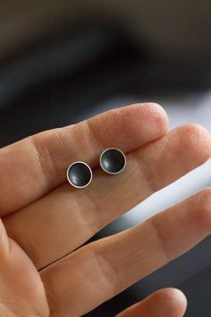 "These stud earrings made in the form of a cup are a perfect piece for a girl with a modern taste. These minimalistic earrings are simple and elegant. Made of silver oxidized to black, these studs have a very refined look. The earrings are made of oxidized sterling silver and are lightweight. The size of the cup is approx. 4mm (3/16\") or 7mm (1/4\"). This item is made to order, the production time is up to 5 days. You will receive them gift wrapped for no additional charge." Minimalist Black Sterling Silver Earrings, Everyday Black Oxidized Earrings, Minimalist Oxidized Round Earrings, Minimalist Round Earrings With Oxidized Finish, Minimalist Hand Forged Earrings, Minimalist Everyday Jewelry With Oxidized Finish, Everyday Minimalist Jewelry With Oxidized Finish, Simple Black Sterling Silver Jewelry, Minimalist Hand Forged Earrings For Everyday